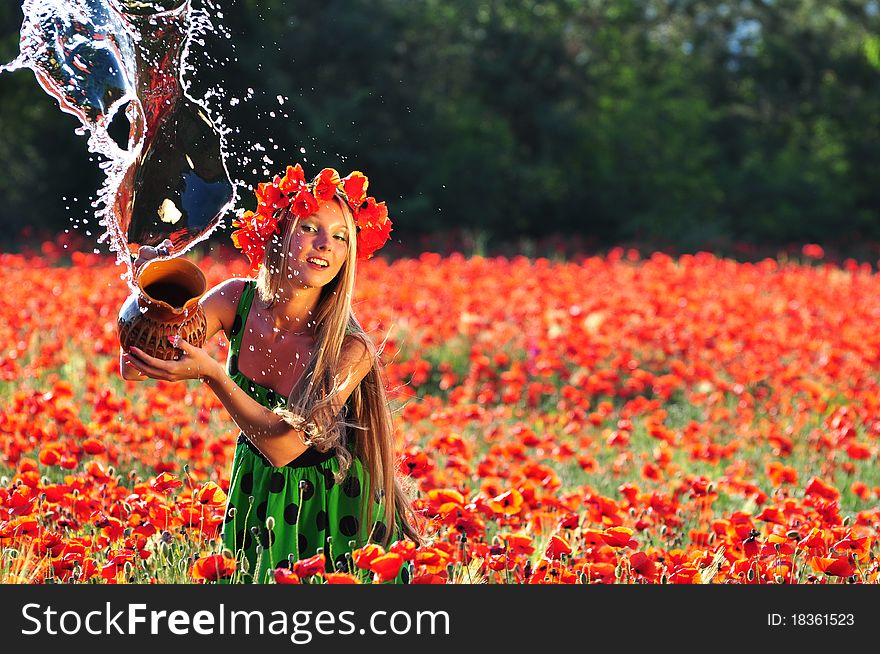 The beautiful girl pours out water. The beautiful girl pours out water