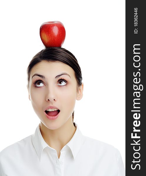 An image of girl with apple on her head. An image of girl with apple on her head.