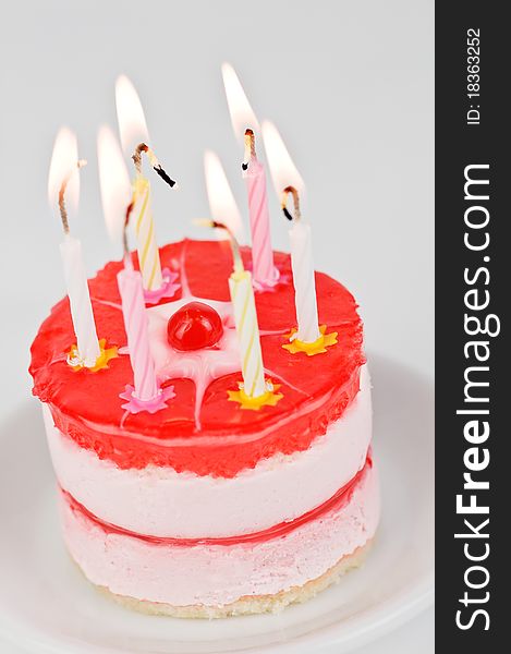 Cake with candle on wood table