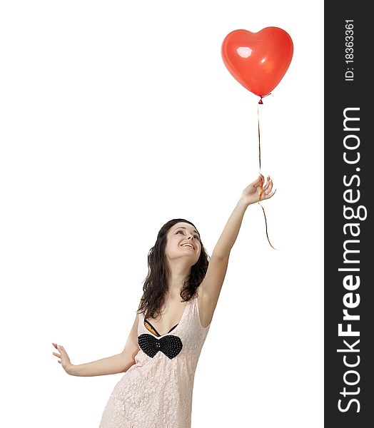Photo of a young woman , holding red inflatable Valentines Day heart. Photo of a young woman , holding red inflatable Valentines Day heart.