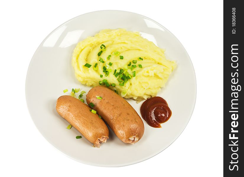 Two sausages with mashed potatoes on a plate isolated on white background
