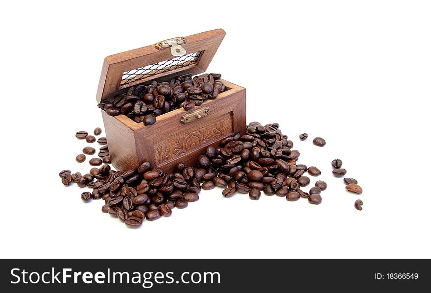 A wood box filled with coffe beans on a white background. A wood box filled with coffe beans on a white background