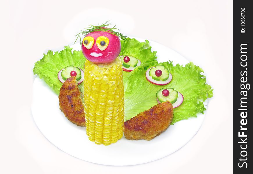 Creative vegetable peacock bird with corn on lettuce salad