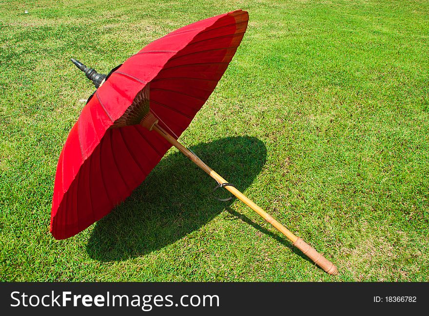 Red umbrella on the lawn