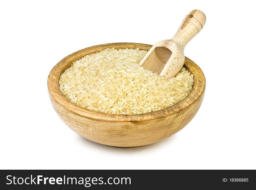 Rice in wood plate isolated