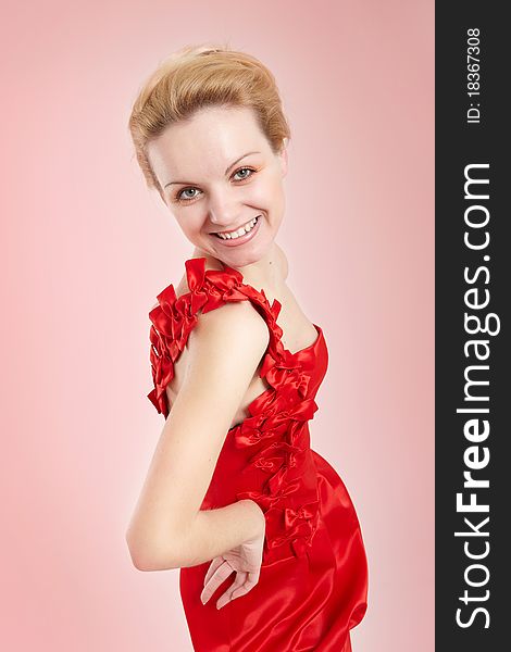 Fashion girl in red dress on pink background. Fashion girl in red dress on pink background