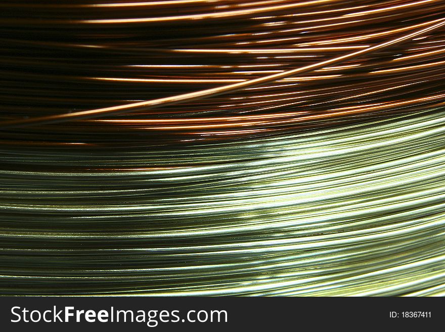 Coil of industrial brown and green wire. Coil of industrial brown and green wire