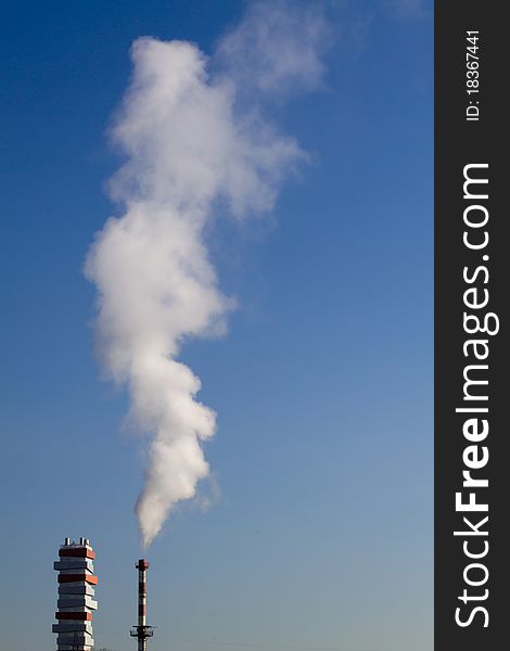 Smoke chimney of incinerator in the blue sky. Smoke chimney of incinerator in the blue sky