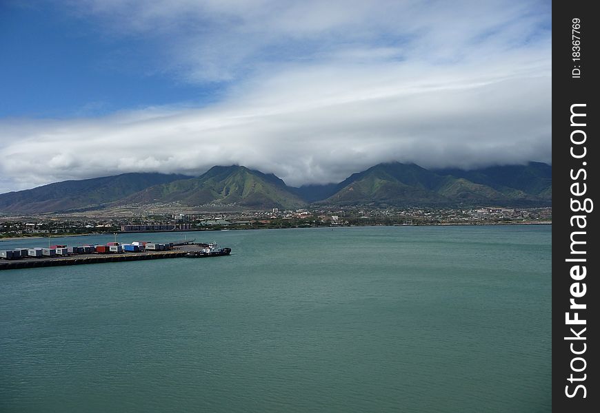 Clouds over mountains at dockyard