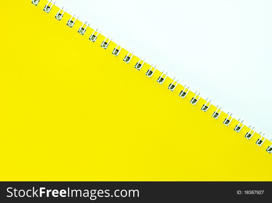 A yellow notebook with a white background. A yellow notebook with a white background.