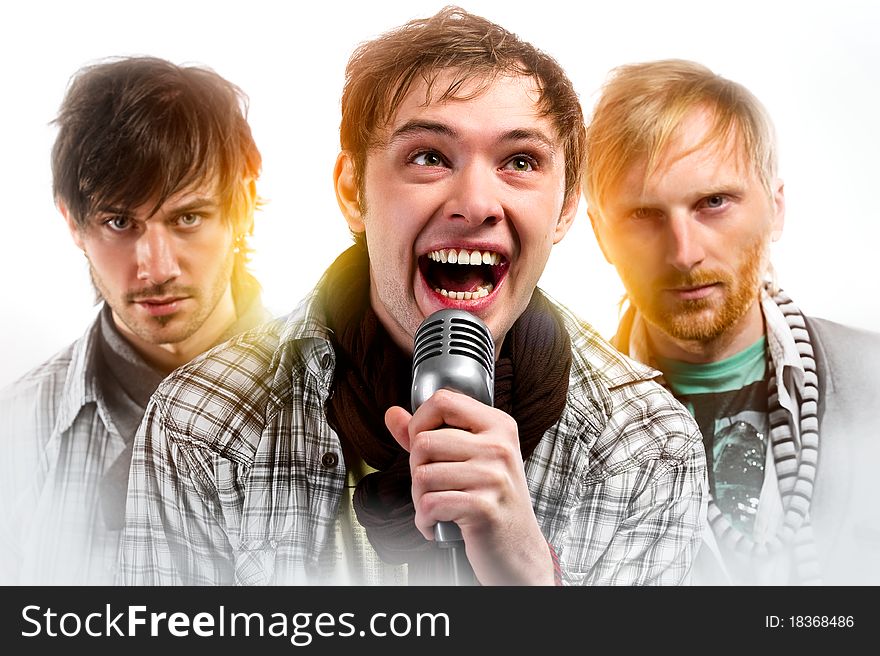 Portrait of three handsome musicians over white background