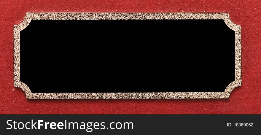 Empty metal plate on red background