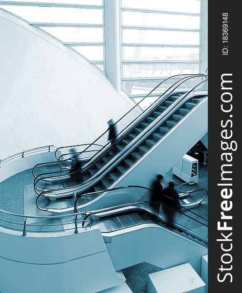 Architectural detail of escalator and people. Architectural detail of escalator and people