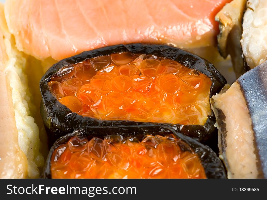 Many tasty fresh japanese sushi with caviar