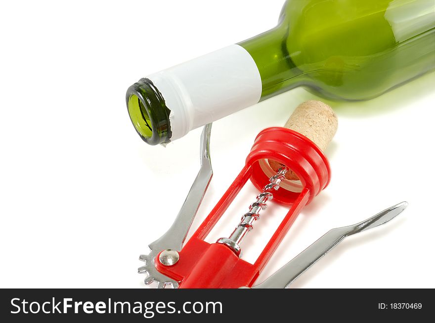 Bottle of wine and a corkscrew isolated on white background. Bottle of wine and a corkscrew isolated on white background