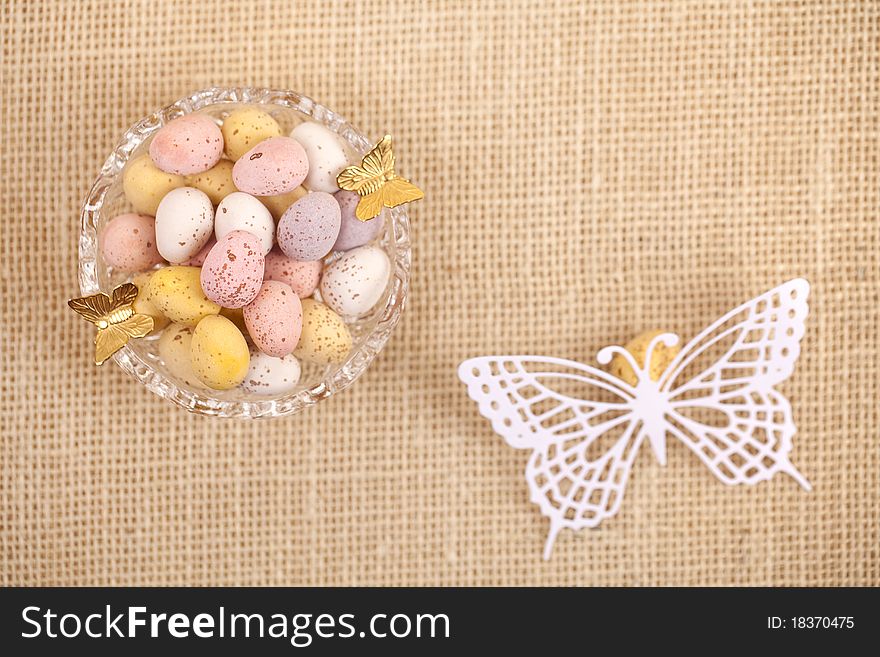Easter chocolate speckled eggs in bowl butterfly