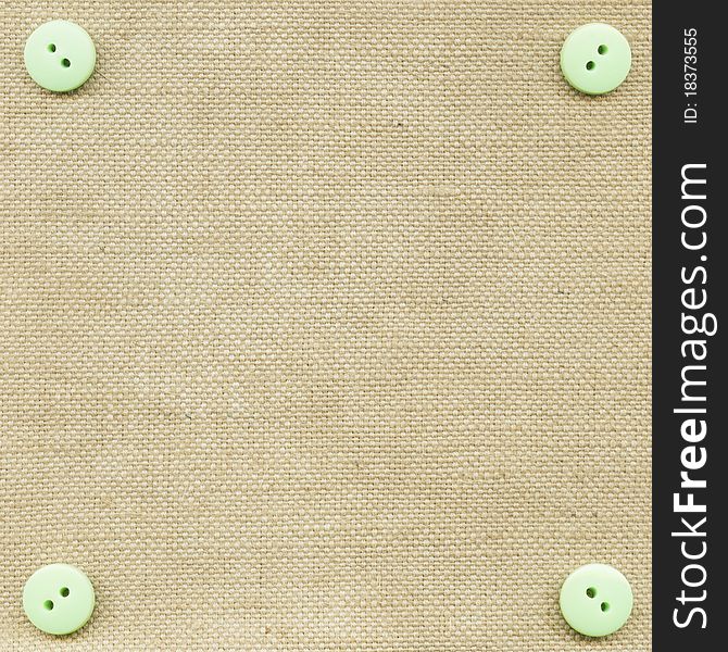 Buttons on fabric as background