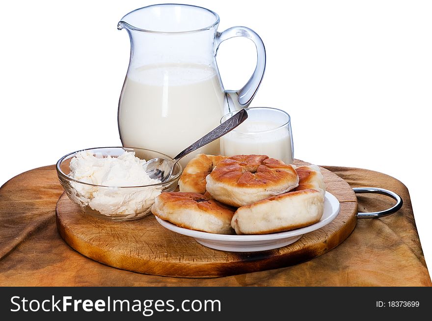 Rural pies with meat and house milk - a breakfast of the farmer. Rural pies with meat and house milk - a breakfast of the farmer.