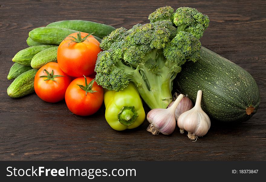 Fresh vegetables: tomatoes, cucumbers, broccoli, zucchini and garlic