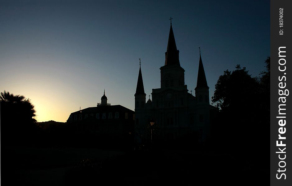 Sun setting behind the St Louis Cathedral in New Orleans. Sun setting behind the St Louis Cathedral in New Orleans