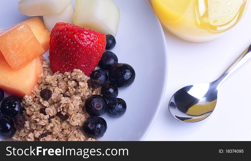 Breakfast of Berries, Melon, Muesli, Orange Juice