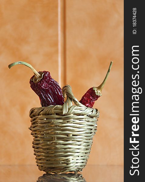Dried chili peppers in a wicker basket
