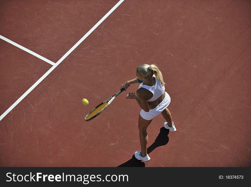 Young Woman Play Tennis Outdoor