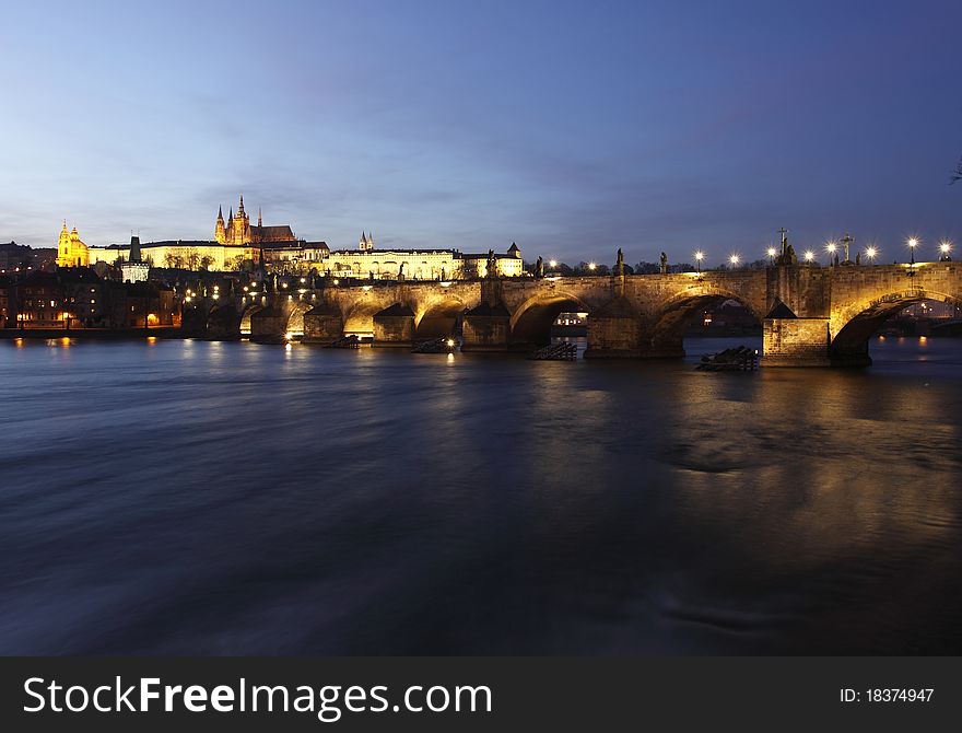 The Prague Castle and Charles Bridge as as two main landmark in Prague at sunset.