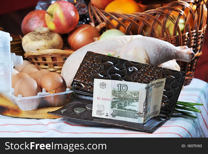 Carcass of a crude chicken, basket of fruit. Carcass of a crude chicken, basket of fruit.