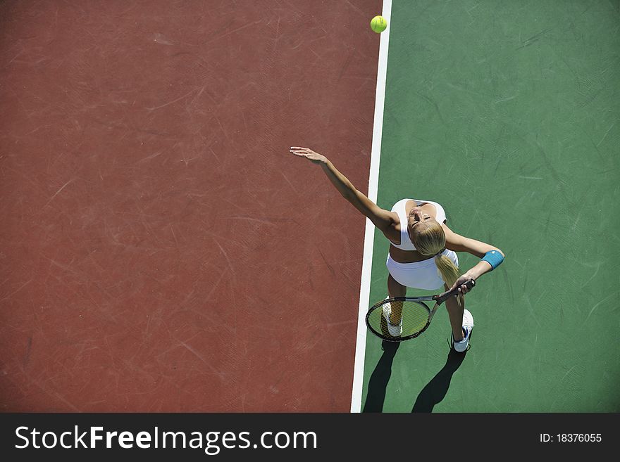 Young woman play tennis outdoor