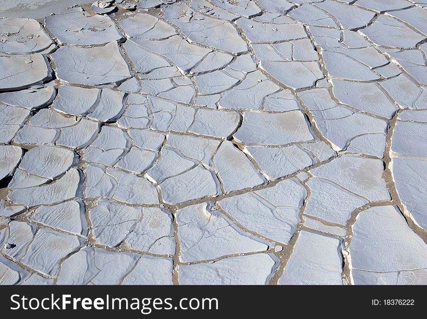 Close-up of a calcareous soil cracked by the drought in the desert Lybique of western Egypt. Close-up of a calcareous soil cracked by the drought in the desert Lybique of western Egypt.