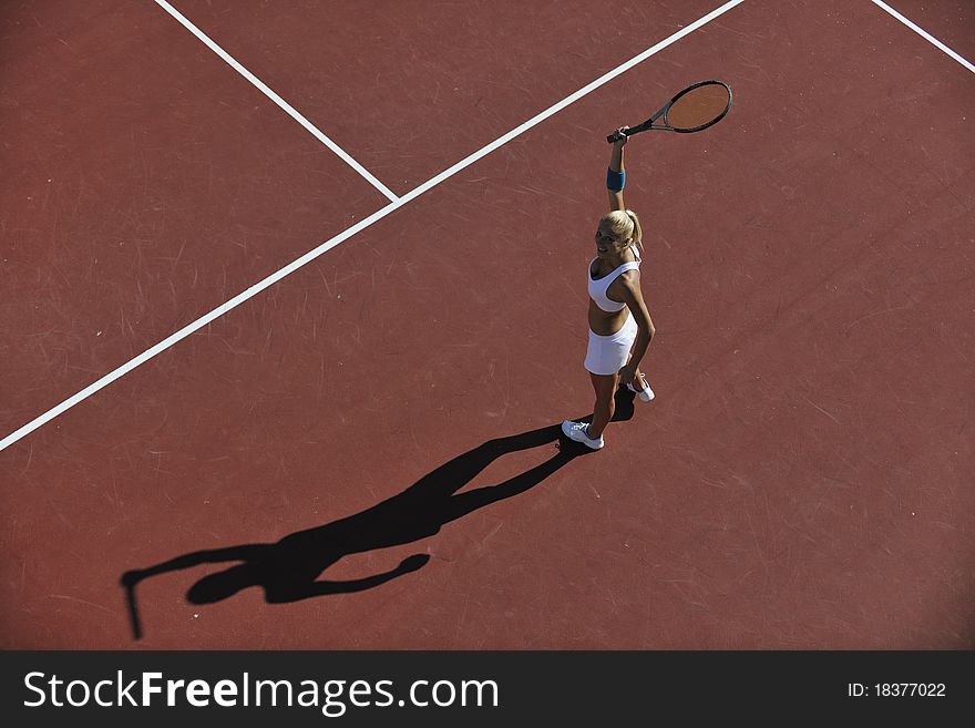 Young woman play tennis outdoor