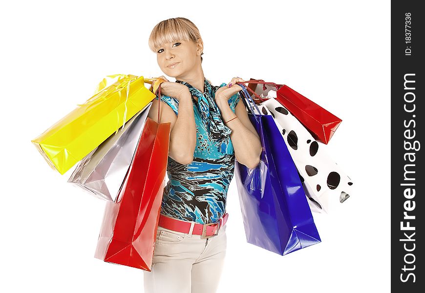 A beautiful portrait of a young attractive woman holding shopping bags and looking contemplative. Isolated over white. A beautiful portrait of a young attractive woman holding shopping bags and looking contemplative. Isolated over white.