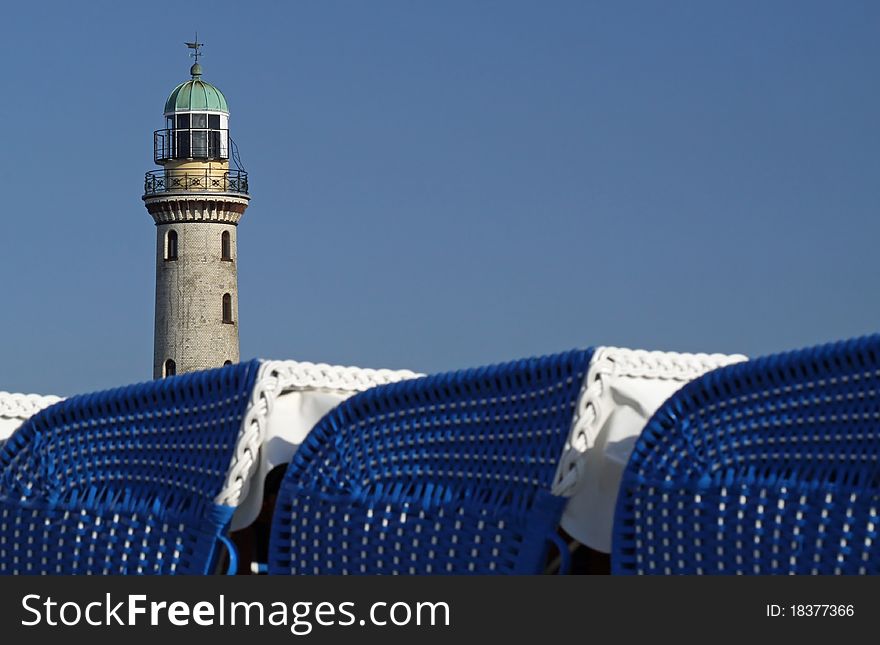 Beach chairs with light tower and copy space