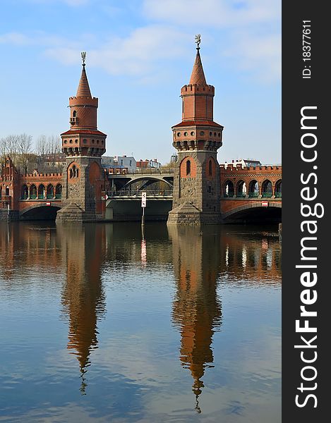Oberbaum bridge and reflection in spree river, berlin, germany. Oberbaum bridge and reflection in spree river, berlin, germany
