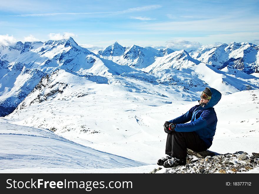Man looking enjoying the view in snowy mountains