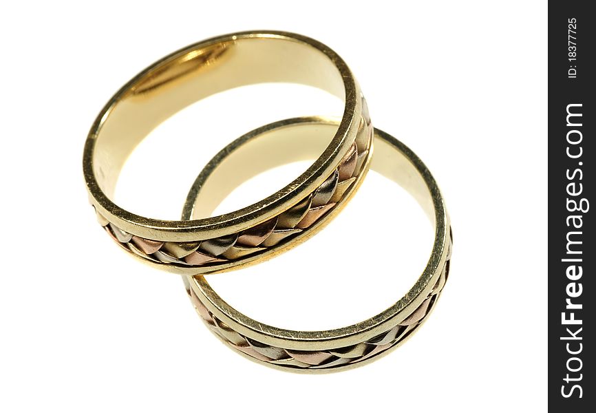 Gold wedding rings on a white background