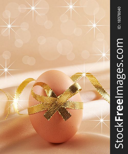 Easter egg with festive bow