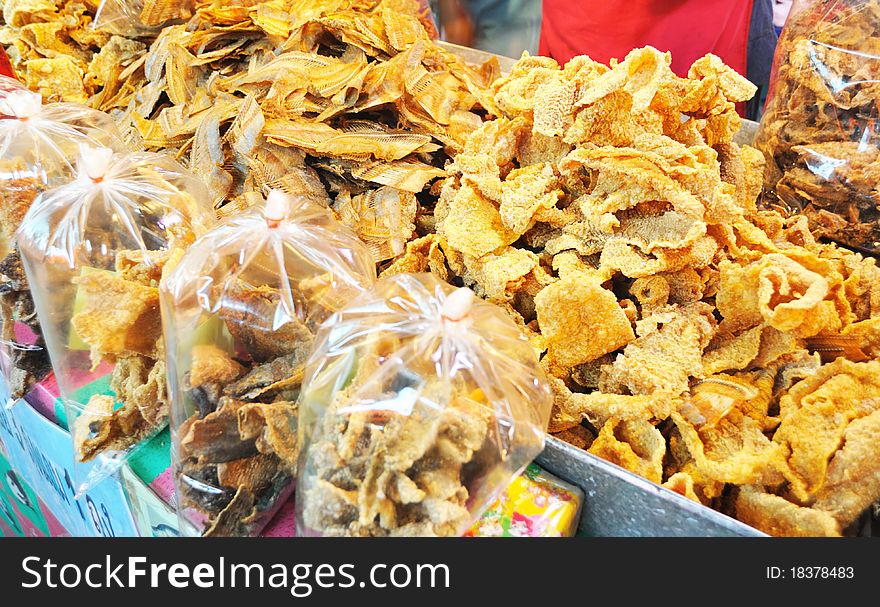 Fired fish in plastic bag at the market. Fired fish in plastic bag at the market