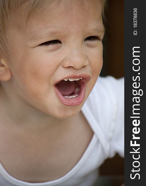 Portrait of screaming boy outside. Portrait of screaming boy outside