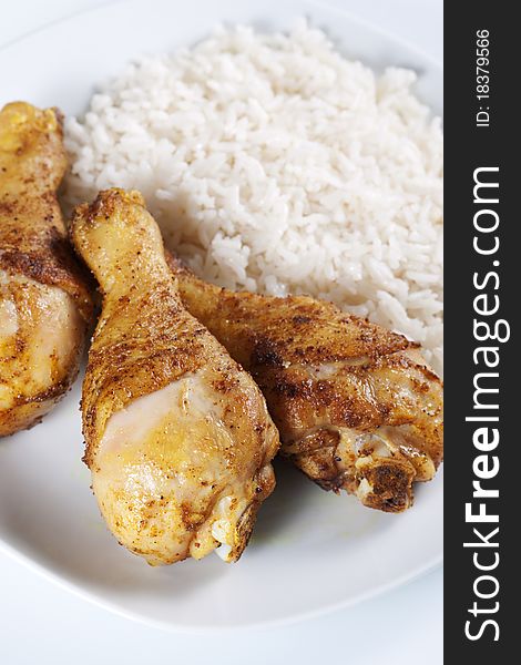 Roasted chicken legs with boiled rice