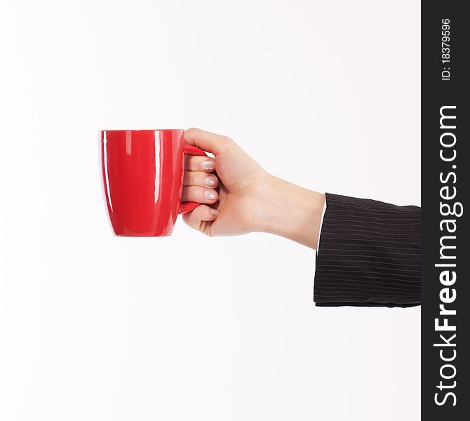 Hand in business suit with red cup on white. Hand in business suit with red cup on white