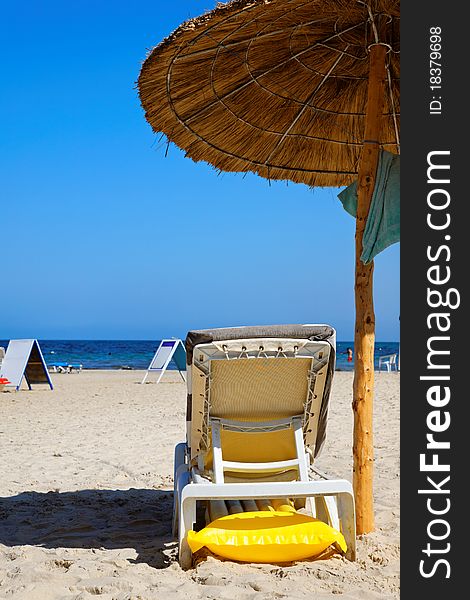 Empty lounge chairs at the seaside. Empty lounge chairs at the seaside.