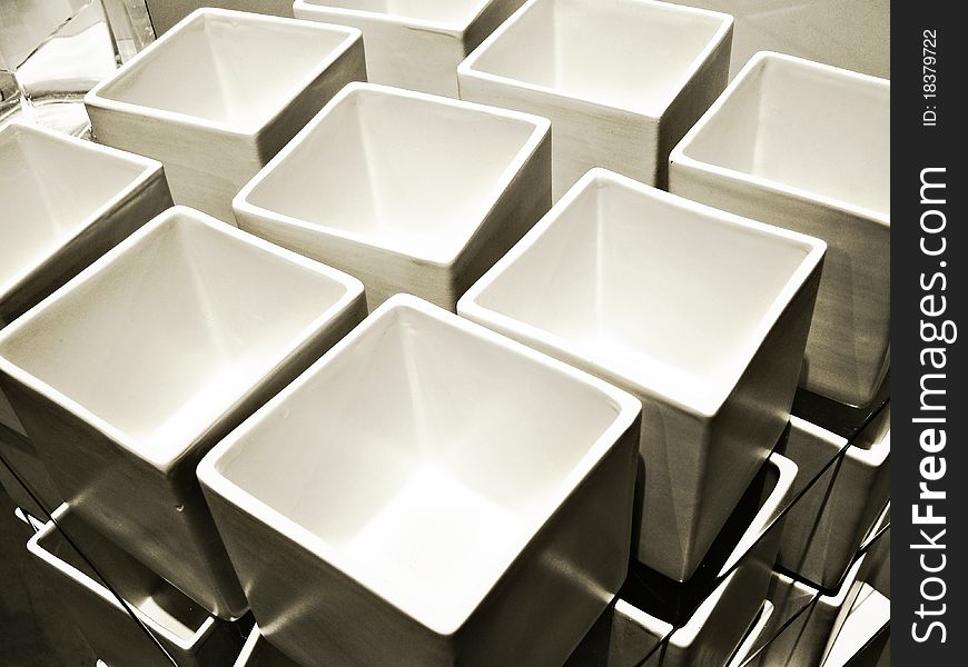 White cubic cups arranged in a structure