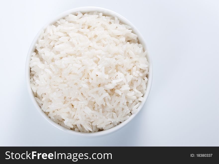 Rice in a bowl on a white background