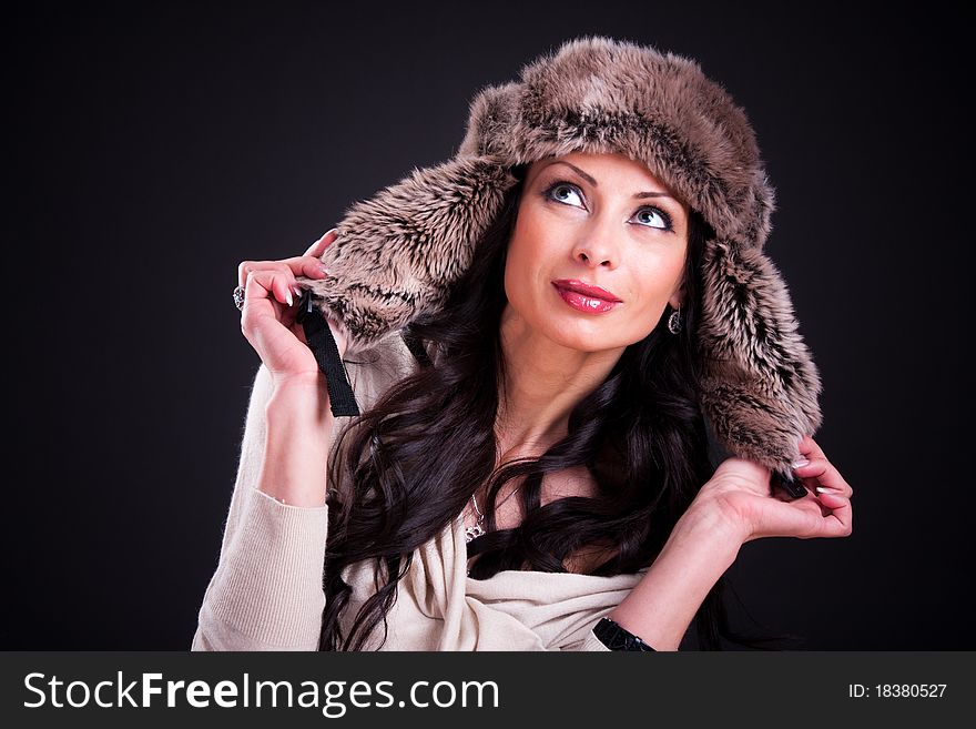 Attractive girl in warm winter fur hat