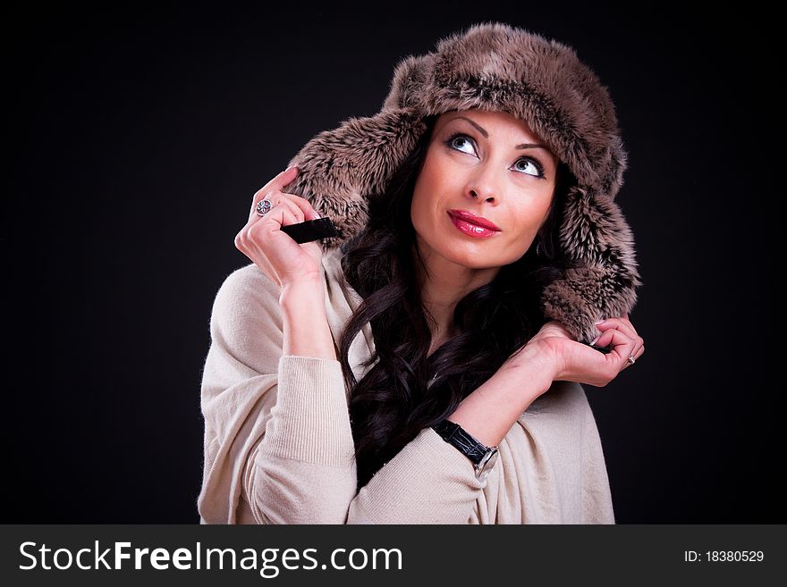Attractive girl in warm winter fur hat