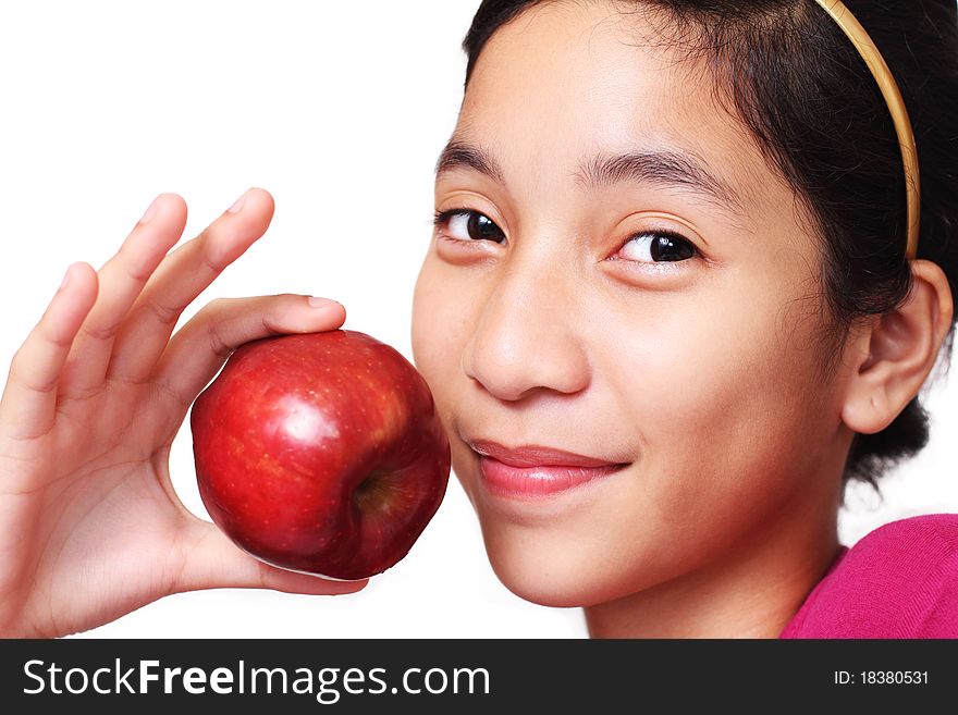 Young asian girl showing an apple. Young asian girl showing an apple