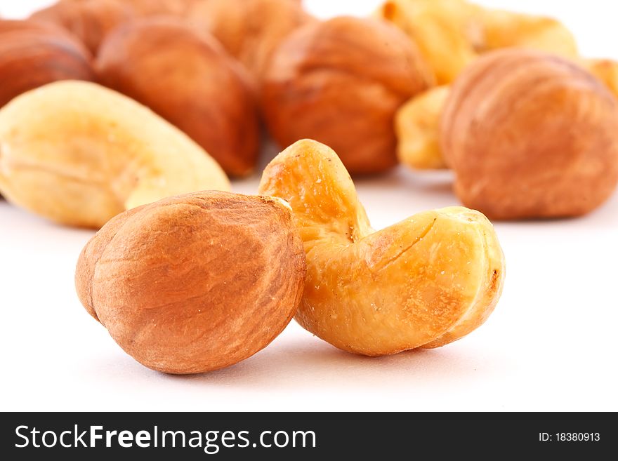 Shelled hazelnuts isolated on white background. Shelled hazelnuts isolated on white background