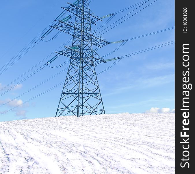 Transmission line support on snow field.